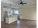 Open-concept kitchen featuring white cabinetry, a spacious island, and modern lighting at 3162 Wayside Rd., Conway, SC 29527