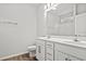 Double vanity bathroom with white cabinets and a large mirror at 387 Lifestyle Court, Surfside Beach, SC 29575