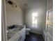 Bathroom featuring granite countertop vanity, white cabinets and updated fixtures at 483 Highway 348, Loris, SC 29569