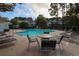 Community pool with lounge chairs and tables at 5825 Catalina Dr. # 433, North Myrtle Beach, SC 29582