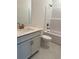 Modern bathroom featuring a sink, toilet, and a bathtub with gold hardware at 8640 Farrier Dr., Myrtle Beach, SC 29588