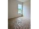 New bedroom with natural light, carpeted floor, and single window at 8640 Farrier Dr., Myrtle Beach, SC 29588