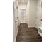 Hallway with wood flooring featuring closet and doorway to laundry room at 8640 Farrier Dr., Myrtle Beach, SC 29588