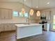 Bright kitchen featuring a large island, pendant lights, and stainless steel appliances at 8640 Farrier Dr., Myrtle Beach, SC 29588