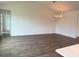 Open-concept living room with modern lighting at 8640 Farrier Dr., Myrtle Beach, SC 29588