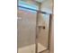 Modern tiled shower stall with glass enclosure and gold hardware at 8640 Farrier Dr., Myrtle Beach, SC 29588