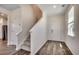 Inviting foyer featuring wood-look flooring, staircase, and natural light at 8648 Farrier Dr., Myrtle Beach, SC 29588