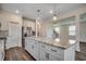Spacious kitchen island with granite countertops and stainless steel appliances in the background at 8648 Farrier Dr., Myrtle Beach, SC 29588