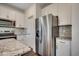 Bright kitchen features stainless steel appliances, granite counters, and attractive backsplash at 8648 Farrier Dr., Myrtle Beach, SC 29588