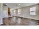 Bright, open living room with lots of natural light, stairs, and neutral paint at 8648 Farrier Dr., Myrtle Beach, SC 29588