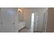 Bright bathroom featuring a white vanity with solid surface counters and tiled floors at 8652 Farrier Dr., Myrtle Beach, SC 29588