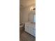 Bright bathroom features a large mirror, modern vanity, and tiled floors at 8652 Farrier Dr., Myrtle Beach, SC 29588