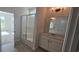 Bathroom with tiled floors, glass-enclosed shower, and modern vanity at 8652 Farrier Dr., Myrtle Beach, SC 29588