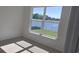Bright bedroom with a window view of the community pond at 8652 Farrier Dr., Myrtle Beach, SC 29588