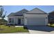 Charming new construction home featuring a two-car garage, landscaped front yard, and inviting entry at 8652 Farrier Dr., Myrtle Beach, SC 29588