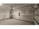 Spacious unfinished garage with plenty of room for vehicles, storage, and a convenient access door at 8652 Farrier Dr., Myrtle Beach, SC 29588