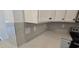 A close-up of a kitchen with a modern countertop, backsplash, and stainless steel appliances at 8652 Farrier Dr., Myrtle Beach, SC 29588