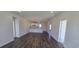 Open-concept living space featuring hard wood floors and modern lighting at 8652 Farrier Dr., Myrtle Beach, SC 29588