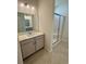 Bathroom featuring tile floors, a single sink vanity, and a glass-enclosed shower at 8663 Farrier Dr., Myrtle Beach, SC 29588