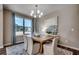Bright dining room with hardwood floors, large window and elegant lighting at 8663 Farrier Dr., Myrtle Beach, SC 29588