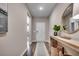 Welcoming entryway featuring hardwood floors, console table, decorative mirror and an elegant rug at 8663 Farrier Dr., Myrtle Beach, SC 29588