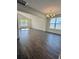Spacious living room with hardwood floors, bright lighting, and vaulted ceilings at 8663 Farrier Dr., Myrtle Beach, SC 29588