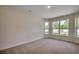 Bright bedroom with large windows offering natural light and outdoor views at 8667 Farrier Dr., Myrtle Beach, SC 29588