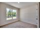 Comfortable bedroom with a large window providing natural light and outdoor views at 8667 Farrier Dr., Myrtle Beach, SC 29588