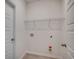 Functional laundry room space with hookups and storage shelves for convenience at 8667 Farrier Dr., Myrtle Beach, SC 29588