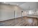 Bright, open-concept living space with wood-look flooring and a view into the modern kitchen at 8667 Farrier Dr., Myrtle Beach, SC 29588
