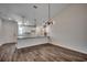 Spacious living and dining area with wood-look floors and stylish pendant lighting at 8667 Farrier Dr., Myrtle Beach, SC 29588