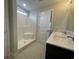 Bathroom with walk-in shower, dual sinks, updated fixtures and modern design elements at 910 Padgett Lane, Conway, SC 29526