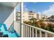Relaxing balcony view with outdoor chair showing the beautiful views of the surrounding landscape at 9581 Shore Dr. # 132, Myrtle Beach, SC 29572