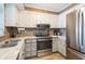 Beautifully updated kitchen boasts stainless steel appliances, white cabinetry, and attractive countertops at 9581 Shore Dr. # 132, Myrtle Beach, SC 29572