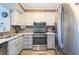 Bright kitchen featuring stainless appliances, plentiful counter space, and white cabinets for a clean, modern appeal at 9581 Shore Dr. # 132, Myrtle Beach, SC 29572