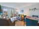 Inviting living room featuring cozy seating, sliding glass doors to the balcony, and stylish nautical decor at 9581 Shore Dr. # 132, Myrtle Beach, SC 29572