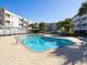 Inviting outdoor swimming pool with ample lounge chairs and lush landscaping for a resort-like experience at 9581 Shore Dr. # 132, Myrtle Beach, SC 29572