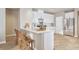 Modern kitchen with stainless steel appliances, a breakfast bar, and white cabinetry at 4009 Braid Ct., Myrtle Beach, SC 29588