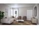 Bright living room with a comfortable sofa, neutral decor, and ample natural light at 4009 Braid Ct., Myrtle Beach, SC 29588