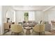 Bright living room with hardwood floors, large windows, neutral-toned furniture, and decorative accents at 4009 Braid Ct., Myrtle Beach, SC 29588
