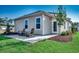 Charming backyard patio with outdoor seating, surrounded by well-maintained lawn and landscaping, ideal for relaxing at 4009 Braid Ct., Myrtle Beach, SC 29588