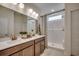Elegant bathroom with double vanity, modern fixtures, and a walk-in shower with glass door at 4009 Braid Ct., Myrtle Beach, SC 29588