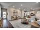 Open-concept living room with modern furnishings and a seamless flow into the kitchen and dining area at Tbb1 Farrier Dr., Myrtle Beach, SC 29588