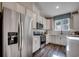Modern kitchen equipped with stainless steel appliances, white cabinets, and a window for natural light at 8644 Farrier Dr., Myrtle Beach, SC 29588