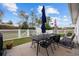 Relaxing backyard patio with table, chairs, and umbrellas at 1672 Langley Dr., Longs, SC 29568