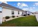 White house exterior with landscaped yard and white fence at 1672 Langley Dr., Longs, SC 29568