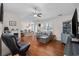 Hardwood floors, gray couch, and built-in shelving at 1672 Langley Dr., Longs, SC 29568