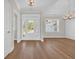 Spacious foyer featuring hardwood floors, light walls, crown molding, and view to front lawn at 2588 Lake Vista Dr., Little River, SC 29566