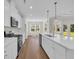 Contemporary kitchen with a large island, stainless steel appliances, and easy access to the dining and living areas at 2588 Lake Vista Dr., Little River, SC 29566
