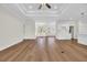 Bright living room showcasing an open layout and hardwood floors that connect seamlessly to the kitchen and dining areas at 2588 Lake Vista Dr., Little River, SC 29566